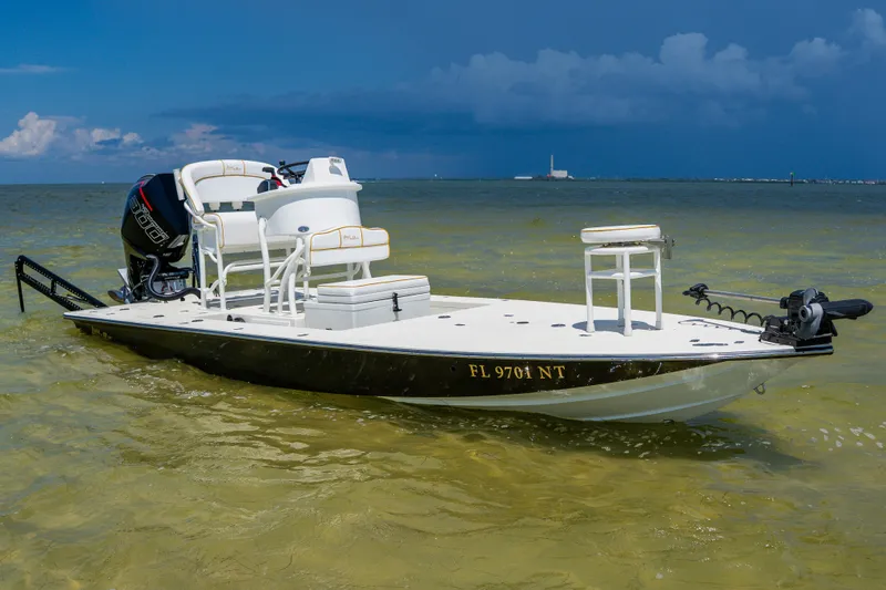 Slide: The Image of 2008 Lake & Bay Boca Grande 20 boat in shallow water, featuring sleek design and powerful motor. - 80