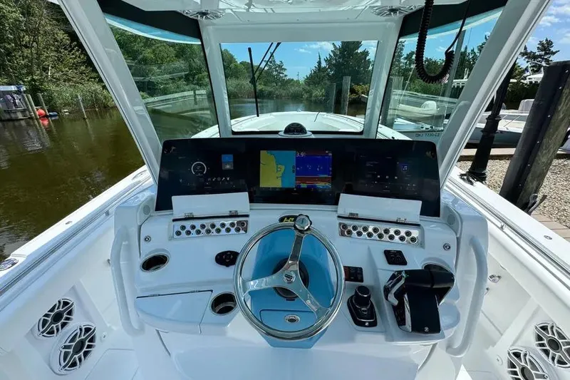 Slide: The Image of 2025 HCB 39 Speciale boat helm with advanced navigation and control systems. - 10