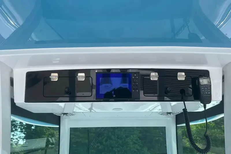 Slide: The Image of 2025 HCB 39 Speciale boat dashboard with control panel and communication device. - 13