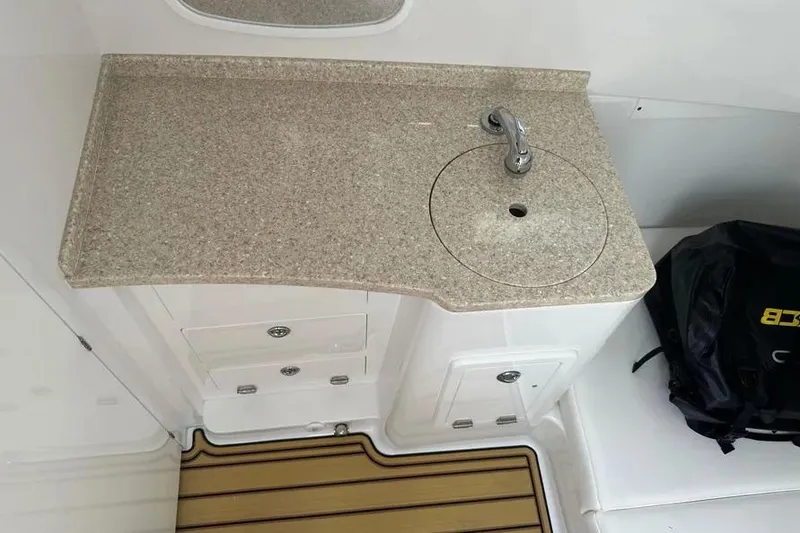 Slide: The Image of 2025 HCB 39 Speciale boat interior with sink and storage compartments. - 20