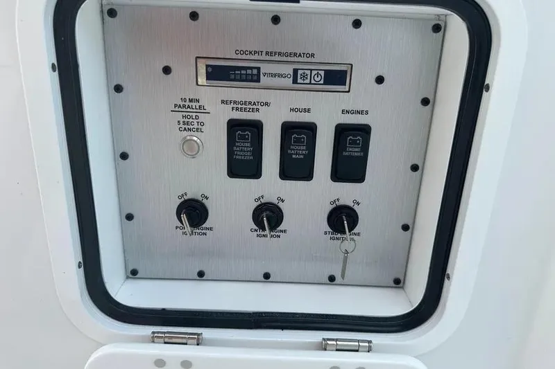 Slide: The Image of Control panel of 2025 HCB 39 Speciale boat, featuring engine and refrigerator switches. - 22
