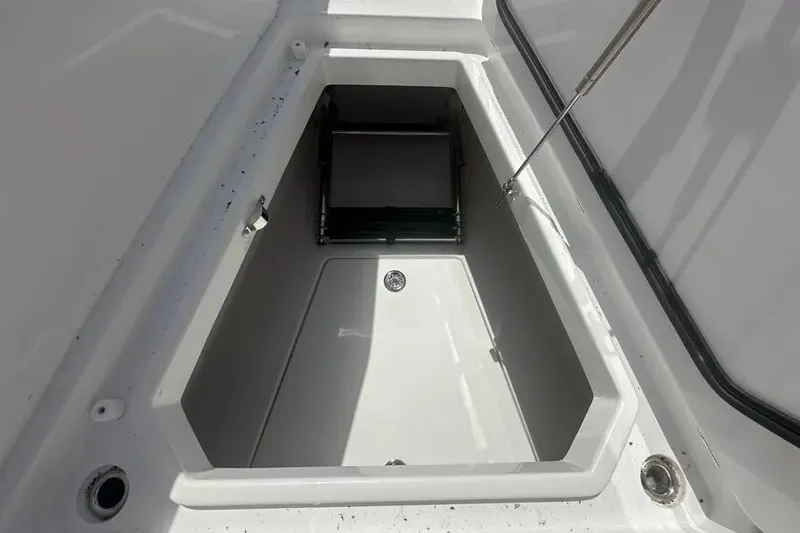 Slide: The Image of Storage compartment of 2025 HCB 39 Speciale boat, featuring a clean, white interior. - 24