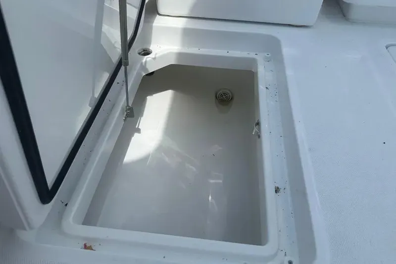 Slide: The Image of Open storage compartment on 2025 HCB 39 Speciale boat, showing interior details. - 26