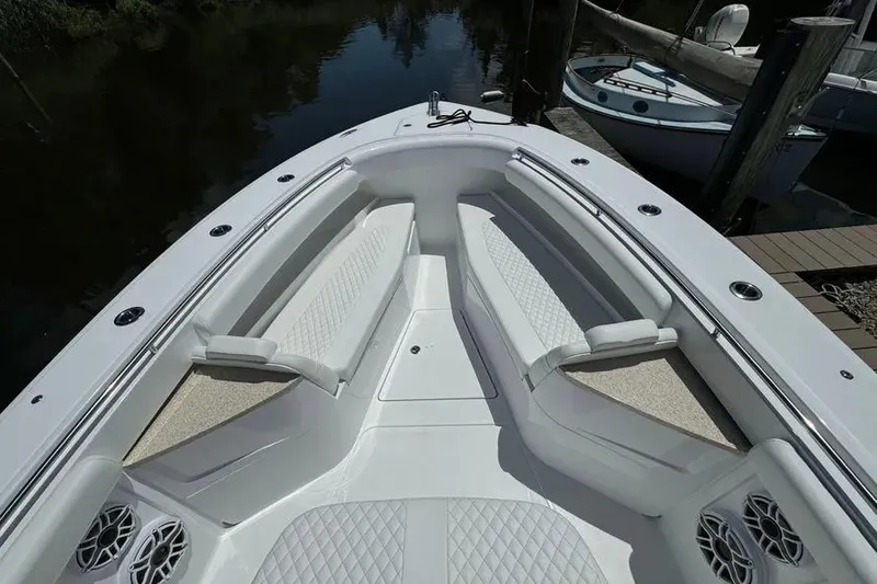 Slide: The Image of 2025 HCB 39 Speciale boat interior with cushioned seating and sleek design. - 3