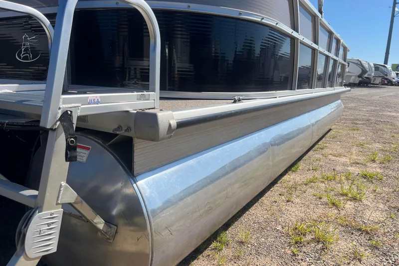 Slide: The Image of 2014 Misty Harbor 2285 Biscayne Bay CU pontoon boat on dry land. - 10