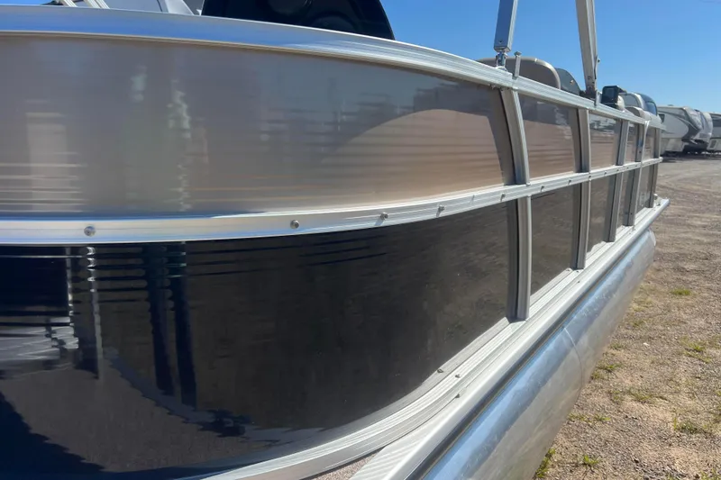Slide: The Image of 2014 Misty Harbor 2285 Biscayne Bay CU pontoon boat side view in a sunny outdoor setting. - 11