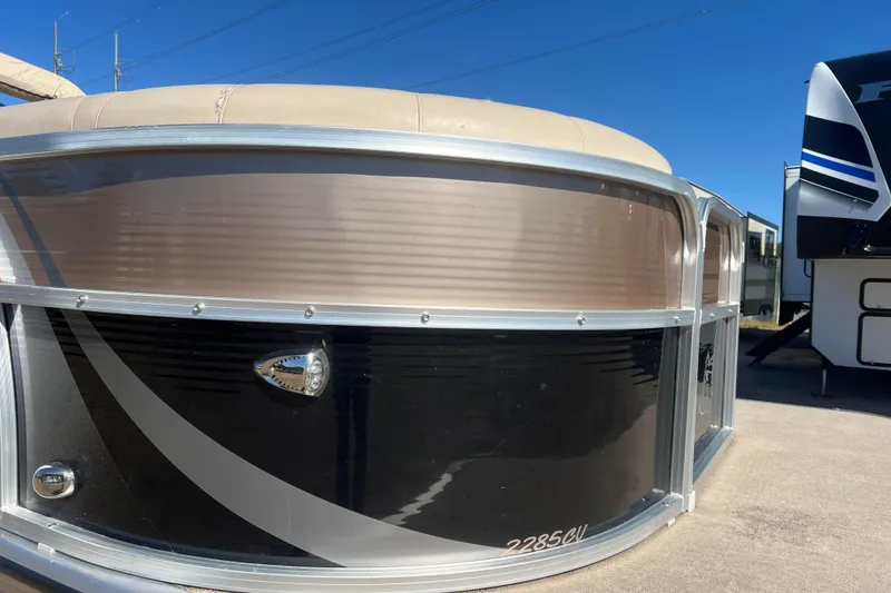 Slide: The Image of 2014 Misty Harbor 2285 Biscayne Bay CU pontoon boat, sleek design, parked outdoors. - 15