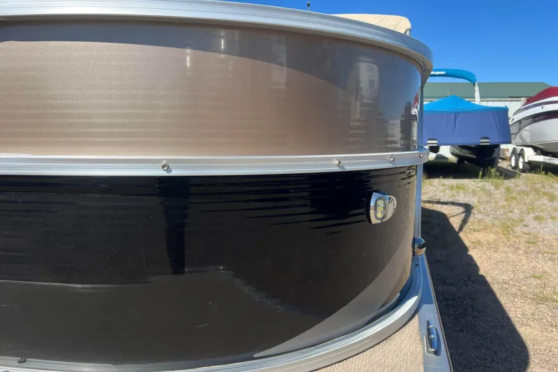 Slide: The Image of 2014 Misty Harbor 2285 Biscayne Bay CU pontoon boat front view in a sunny outdoor setting. - 16