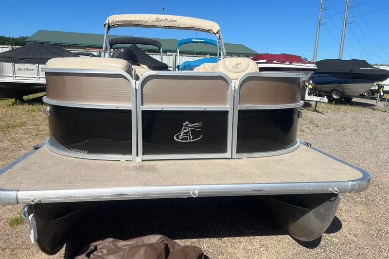 Slide: The Image of 2014 Misty Harbor 2285 Biscayne Bay CU pontoon boat on display outdoors. - 2