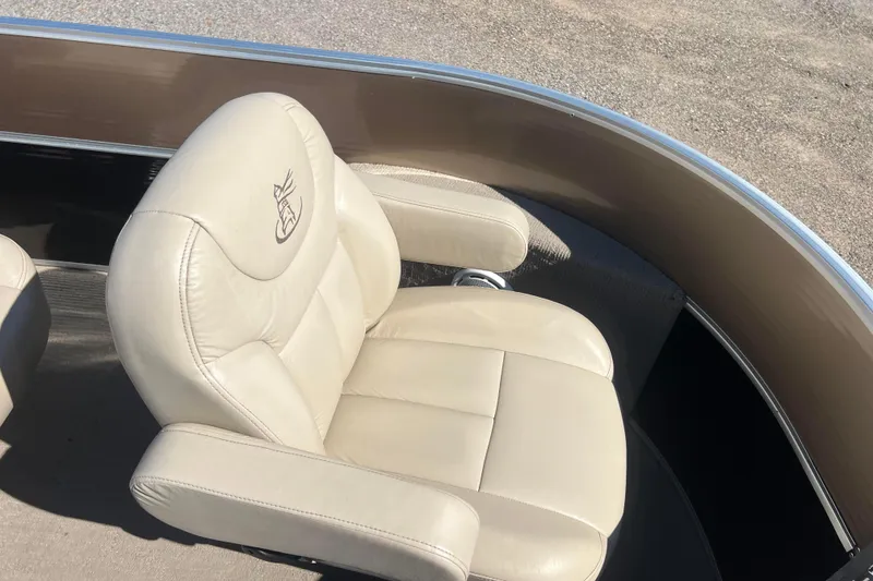 Slide: The Image of 2014 Misty Harbor 2285 Biscayne Bay CU boat seat, beige leather, outdoor setting. - 20