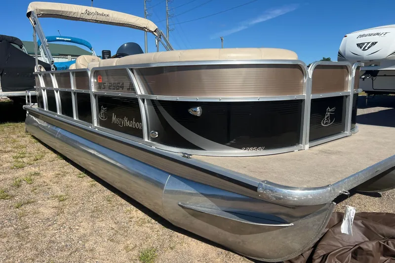 Slide: The Image of 2014 Misty Harbor 2285 Biscayne Bay CU pontoon boat in a parking lot. - 3
