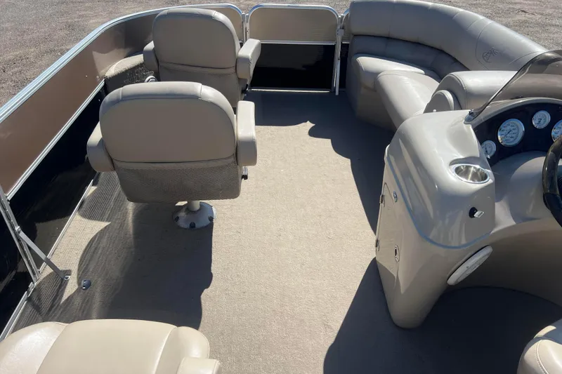 Slide: The Image of 2014 Misty Harbor 2285 Biscayne Bay CU pontoon boat interior with seating and control panel. - 35