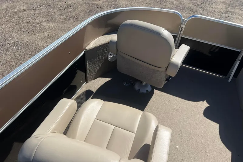 Slide: The Image of 2014 Misty Harbor 2285 Biscayne Bay CU boat interior with beige seating. - 37