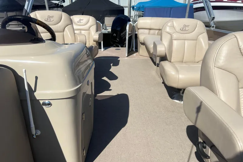 Slide: The Image of 2014 Misty Harbor 2285 Biscayne Bay CU boat interior with beige leather seating. - 41