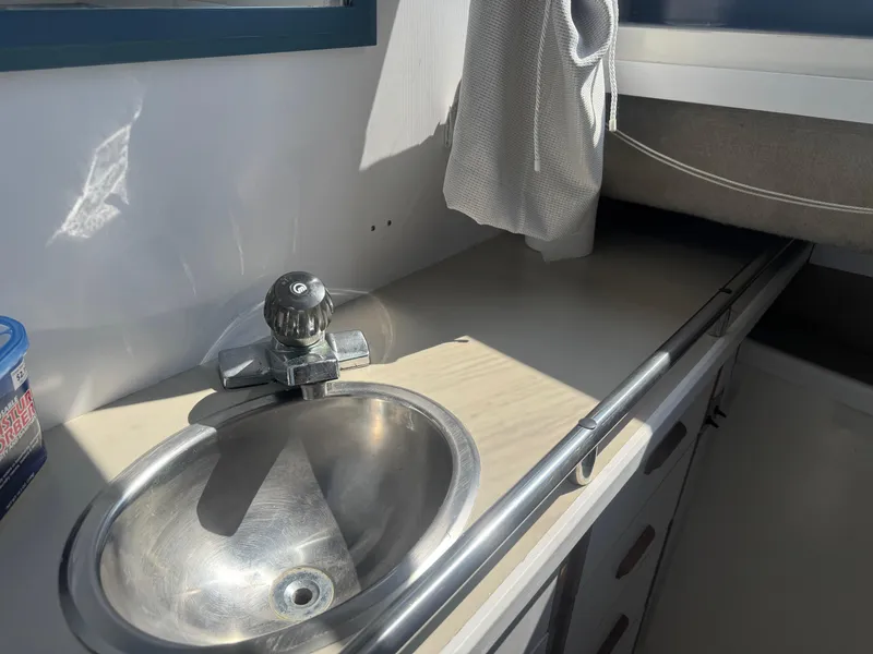 Slide: The Image of 1986 Carver Mariner 28 boat interior with sink and countertop. - 13