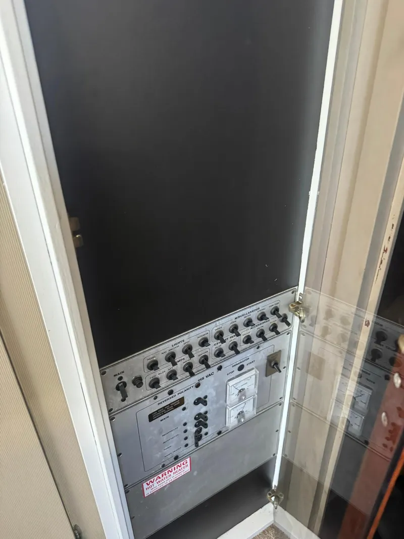 Slide: The Image of Electrical control panel inside a 1986 Carver Mariner 28 boat. - 6