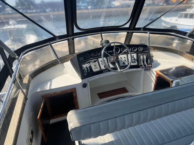 Slide: The Image of Interior helm of 1986 Carver Mariner 28 boat with steering wheel and control panel. - 11