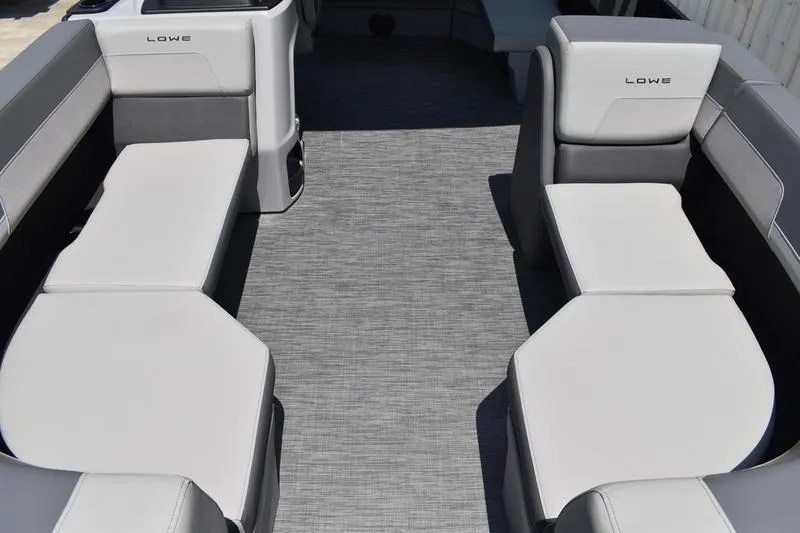 Slide: The Image of Interior storage compartment of 2026 Lowe LS 170 boat with cup holders. - 17