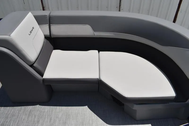 Slide: The Image of 2026 Lowe LS 170 boat storage compartment with curved design and gray interior. - 19