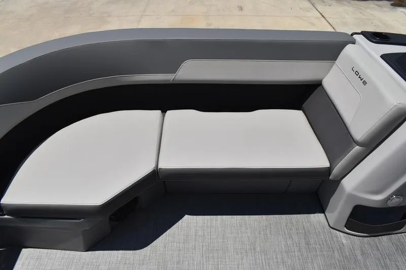 Slide: The Image of Luxurious seating on 2026 Lowe LS 170 boat, featuring sleek gray upholstery. - 21