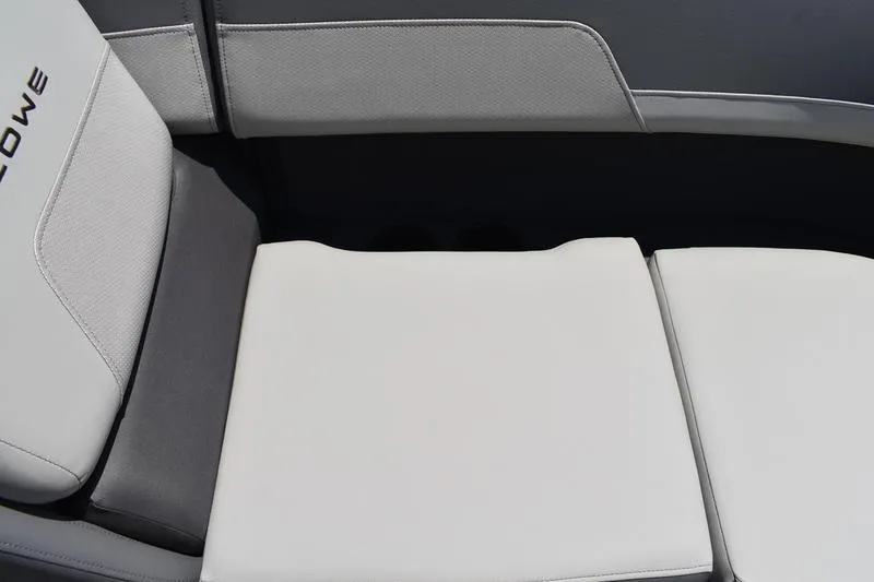 Slide: The Image of Interior of 2026 Lowe LS 170 boat with storage compartment and cup holders. - 25