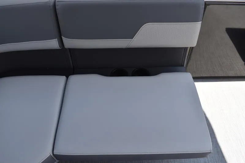 Slide: The Image of Interior view of 2026 Lowe LS 170 boat dashboard with storage compartment and seating capacity label. - 37