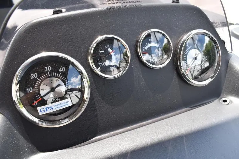 Slide: The Image of 2026 Lowe LS 170 boat seat storage compartment with dual cup holders, gray upholstery. - 40