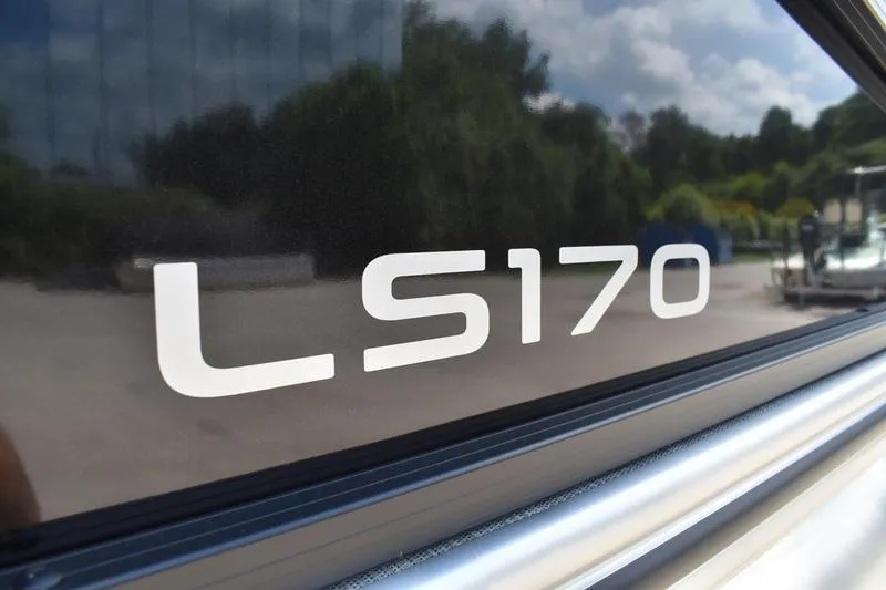 Slide: The Image of 2026 Lowe LS 170 pontoon boat with Mercury outboard motor and boarding ladder. - 6
