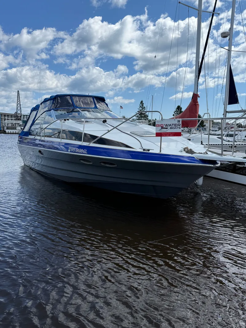 The Image of 1989 Bayliner Avanti 3255 Sunbridge boat docked on a sunny day. - 0