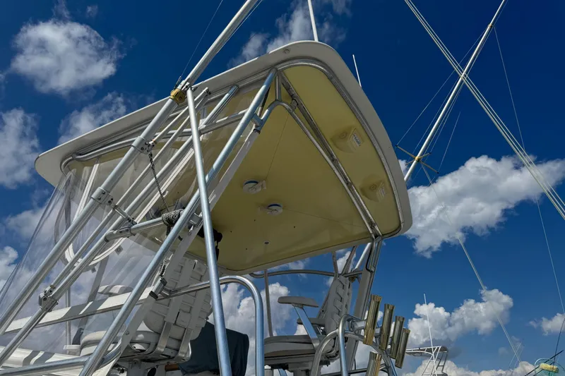 Slide: The Image of 1975 Chris Craft 30 Tournament SF boat with tower against blue sky and clouds. - 10