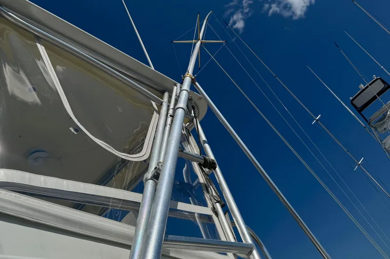 Slide: The Image of 1975 Chris-Craft 30 Tournament SF boat with antennas against a clear blue sky. - 19