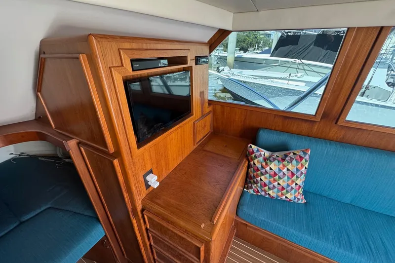 Slide: The Image of Interior of 1975 Chris Craft 30 Tournament SF with wood paneling and blue seating. - 24
