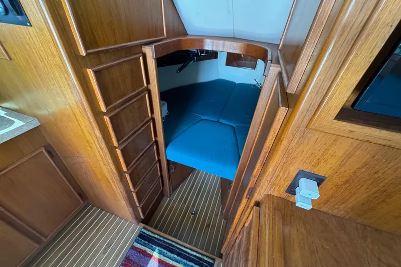 Slide: The Image of Interior of 1975 Chris Craft 30 Tournament SF with wooden finish and blue seating. - 25