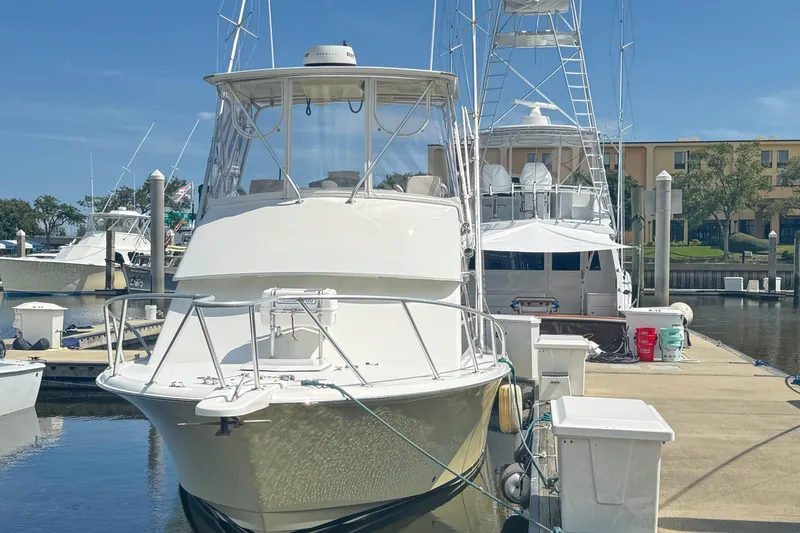 Slide: The Image of 1975 Chris Craft 30 Tournament SF boat docked at marina under clear blue sky. - 5