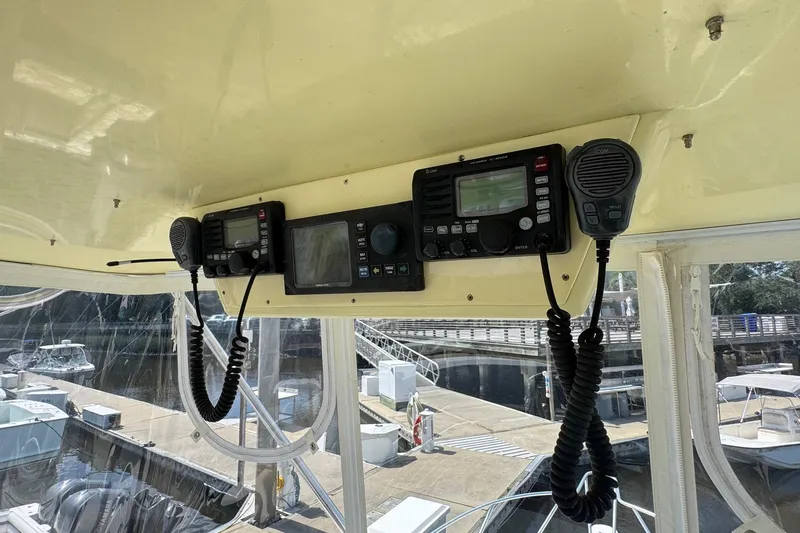 Slide: The Image of 1975 Chris-Craft 30 Tournament SF boat cockpit with communication equipment. - 8