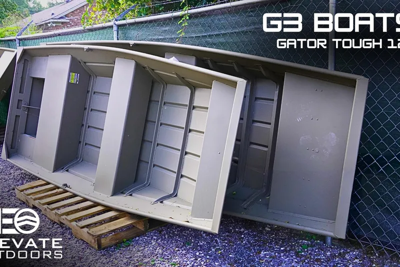 The Image of 2026 G3 Gator Tough 1236 boat displayed outdoors on wooden pallets. - 1