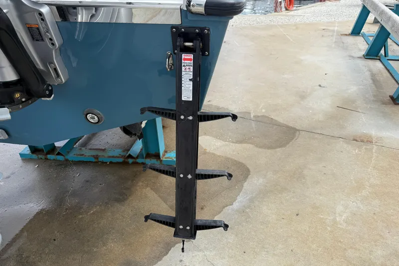 Slide: The Image of Boat ladder attached to a 2023 Front Runner 33 CC, displayed on a concrete surface. - 13