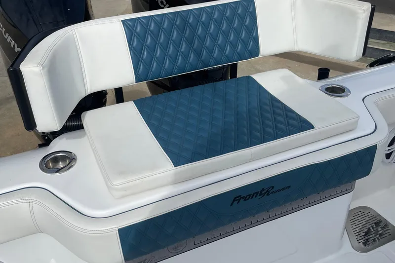 Slide: The Image of 2023 Front Runner 33 CC boat seat with blue and white diamond-patterned upholstery. - 18