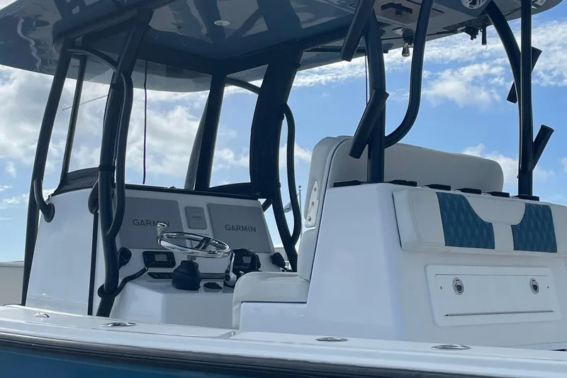 Slide: The Image of 2023 Front Runner 33 CC boat interior with Garmin navigation system. - 24
