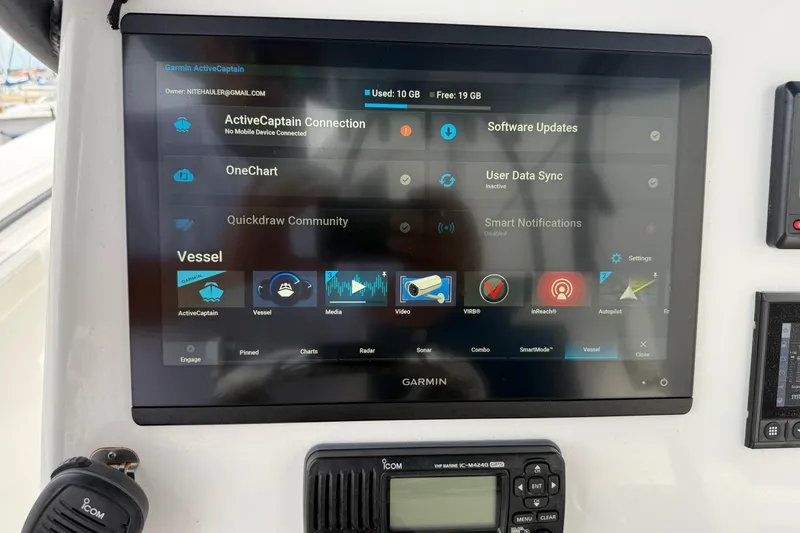 Slide: The Image of Garmin marine display on 2023 Front Runner 33 CC boat, showing navigation and connectivity options. - 28