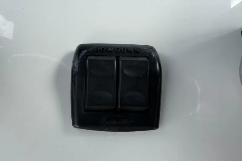 Slide: The Image of Control panel on 2023 Front Runner 33 CC boat, featuring dual switches labeled "BOW DOWN." - 35