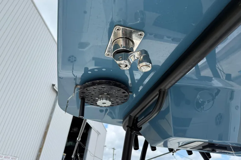 Slide: The Image of 2023 Front Runner 33 CC boat detail, featuring stainless steel hardware and blue hull. - 38