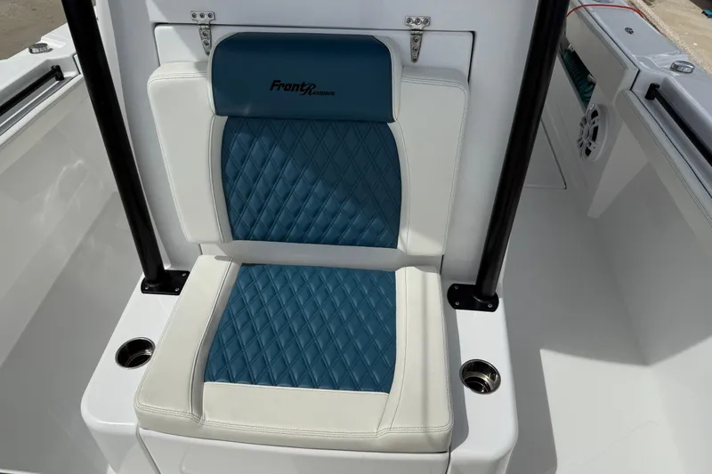 Slide: The Image of Front Runner 33 CC 2023 boat seat with blue and white diamond-patterned upholstery. - 43