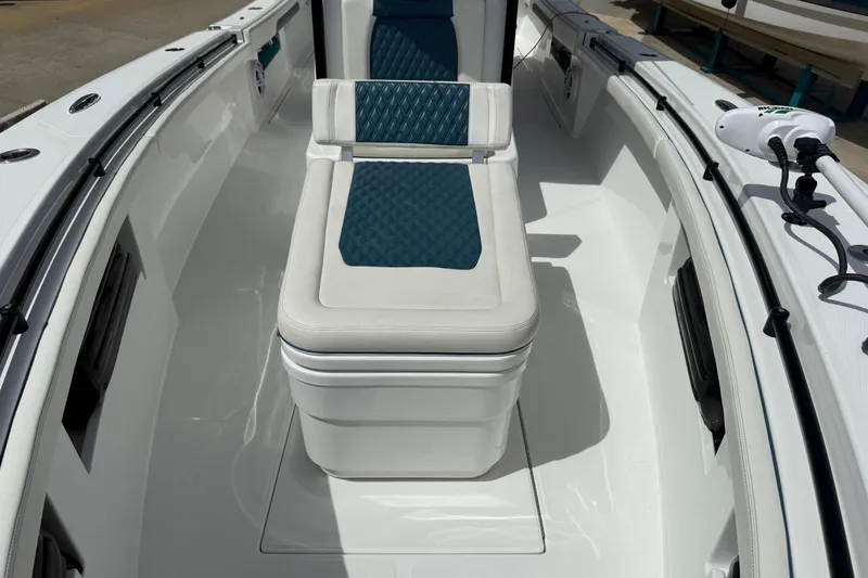 Slide: The Image of 2023 Front Runner 33 CC boat interior with cushioned seating and sleek design. - 44