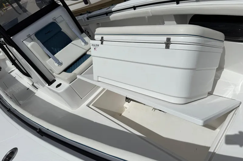 Slide: The Image of 2023 Front Runner 33 CC boat interior with seating and storage compartment. - 47