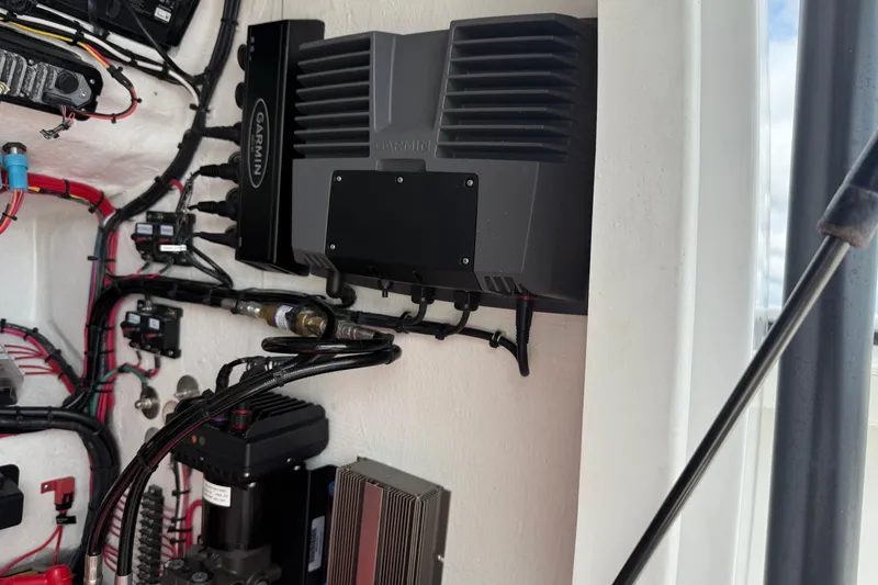 Slide: The Image of Electrical system inside 2023 Front Runner 33 CC boat, featuring Garmin equipment and wiring. - 49