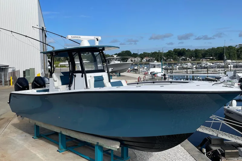 Slide: The Image of 2023 Front Runner 33 CC boat docked at marina, featuring sleek design and modern equipment. - 5