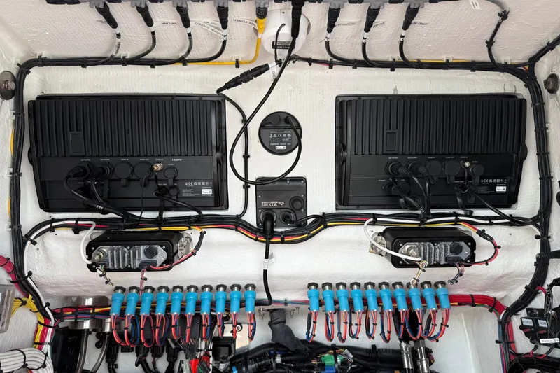 Slide: The Image of Electrical system of a 2023 Front Runner 33 CC boat, featuring organized wiring and components. - 50