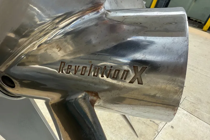 Slide: The Image of Close-up of a Revolution X propeller on a 2023 Front Runner 33 CC boat. - 53