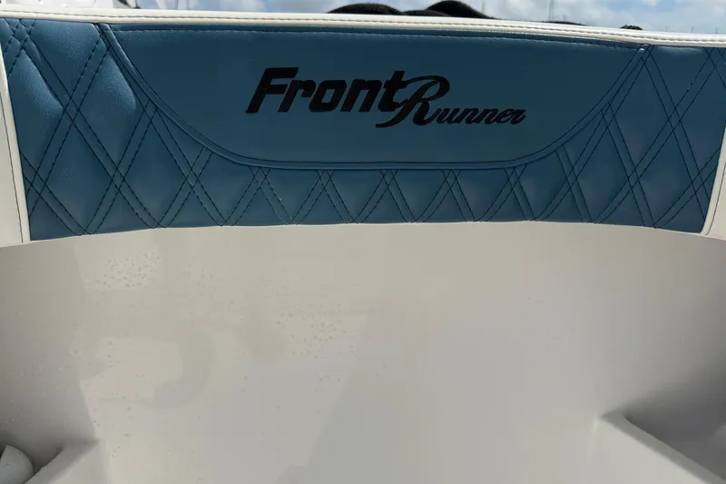 Slide: The Image of 2023 Front Runner 33 CC boat seat with blue diamond stitching. - 54